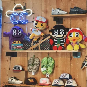 Display of vintage McDonalds plus toys, shoes and hats.